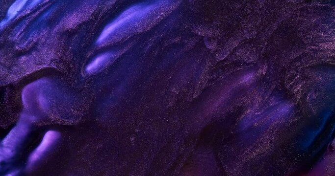 Dark purple paint abstract background. Brilliant dark lilac blue ink in motion. Black violet moving liquid texture. Fluid art backdrop. Acrylic move pattern texture. Shiny artwork in slow motion 