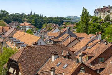 Fototapeta na wymiar View of the roofs of the old buildings of the city, the skyline of the city of Bern, Switzerland