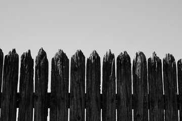 Fototapeta premium Old wooden fence in a black and white monochrome.