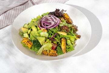 Healthy food Salad with edamame and avocado vegetables on white background for restaurant menu.