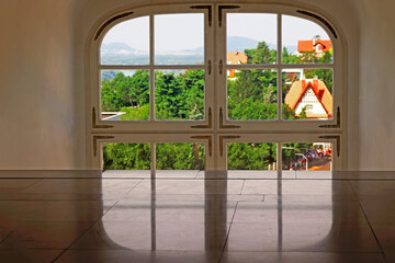 Window view of Bratislava, Slovakia. Part of the window, reflection of the window on the floor