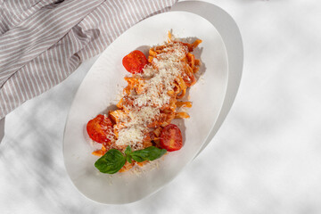 Homemade Bucatini, Amatriciana Pasta with bacon, cherry tomatoes and parmesan