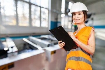 Young engineer on factory, checking up process