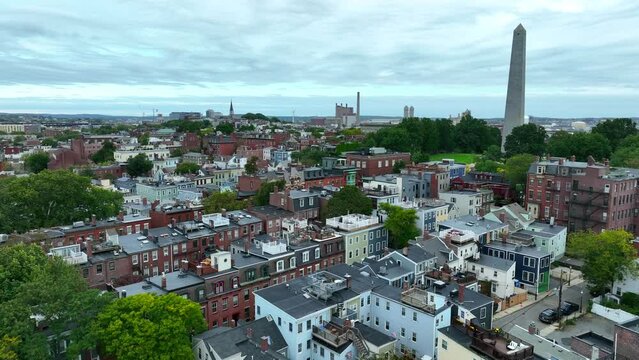 Charlestown neighborhood in Boston. Aerial of Bunker Hill Monument on overcast day. Residential community in Massachusetts USA. Aerial establishing shot.