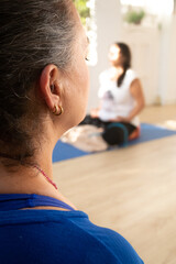 Fototapeta premium detail of the yoga teacher's face while meditating.
