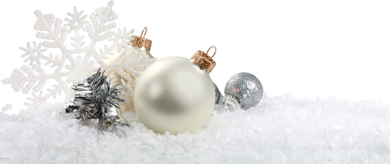 Fototapeta Silver christmas balls over snow isolated on white obraz