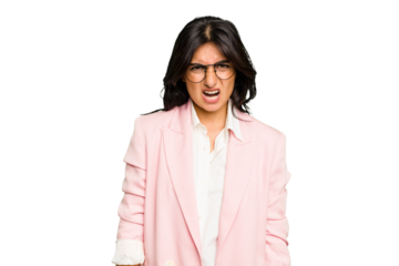 Young Indian business woman wearing a pink suit isolated screaming very angry and aggressive.