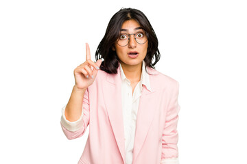 Young Indian business woman wearing a pink suit isolated having an idea, inspiration concept.