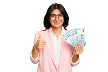 Young business Indian woman holding banknotes isolated smiling and raising thumb up