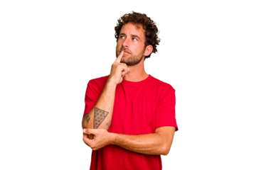 Young caucasian curly hair man isolated Young caucasian man with curly hair isolated looking sideways with doubtful and skeptical expression.