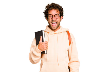 Young caucasian student man isolated screaming very angry and aggressive.