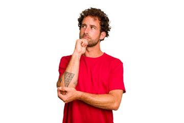 Young caucasian curly hair man isolated Young caucasian man with curly hair isolated looking sideways with doubtful and skeptical expression.