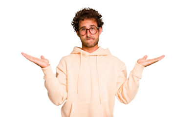 Young caucasian curly hair man isolated Young caucasian man with curly hair isolated confused and doubtful shrugging shoulders to hold a copy space.