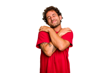 Young caucasian curly hair man isolated Young caucasian man with curly hair isolated hugs, smiling carefree and happy.