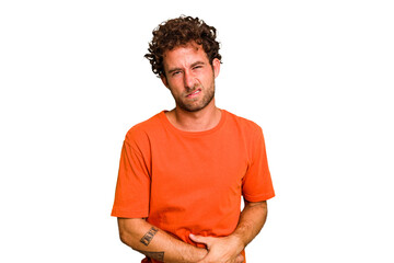 Fototapeta premium Young caucasian curly hair man isolated Young caucasian man with curly hair isolated having a liver pain, stomach ache.