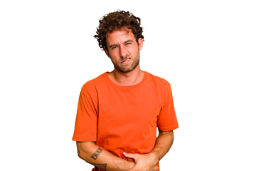 Young caucasian curly hair man isolated Young caucasian man with curly hair isolated having a liver pain, stomach ache.