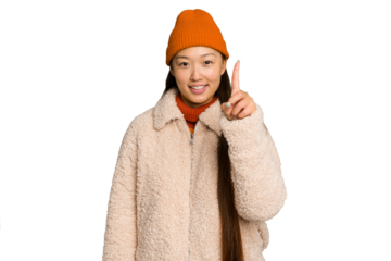 Young asian woman wearing winter clothes isolated on green chroma background showing number one with finger.