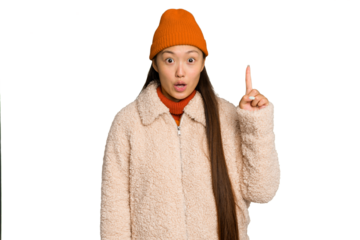 Young asian woman wearing winter clothes isolated on green chroma background having some great idea, concept of creativity.