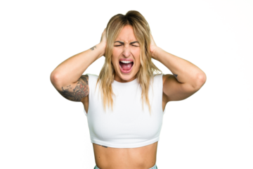 Young caucasian woman isolated on green chroma background covering ears with hands trying not to hear too loud sound.