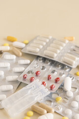 Mix of pills and capsules in a used plastic blisters close up, copy space. Dietary supplements