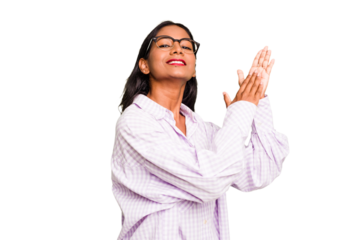 Young Indian woman isolated feeling energetic and comfortable, rubbing hands confident.