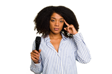 Young African American singer woman holding a microphone isolated pointing temple with finger, thinking, focused on a task.