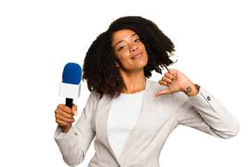 Young TV presenter African American woman with a microphone isolated feels proud and self confident, example to follow.