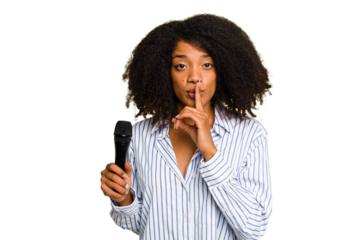 Young African American singer woman holding a microphone isolated keeping a secret or asking for silence.