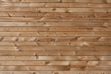 Wood texture background. The texture of the wall is covered with wood. Treated tree. Repairs. Frame construction material. Thin covering board. Lining. Natural wood.	