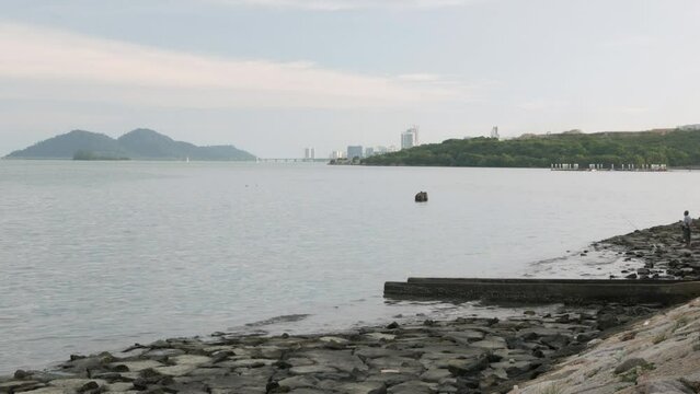 landscape view of the penang bay harbor beach sea coast area with green natural mountain range