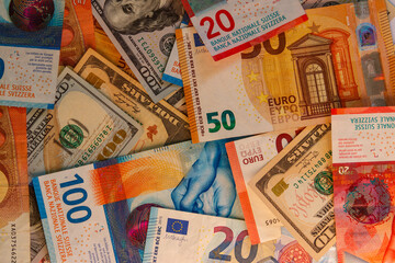 Multicurrency background of US dollars, euros and Swiss francs