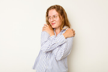 Young caucasian woman isolated on white background hugs, smiling carefree and happy.