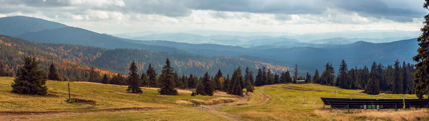 Lovely view of the mountain valleys. Solar panels and mountain meadow in the foreground. Mountains...