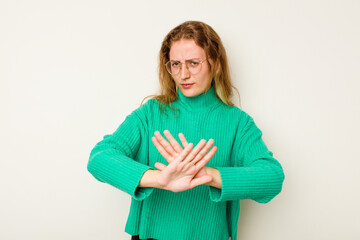 Young caucasian woman isolated on white background doing a denial gesture