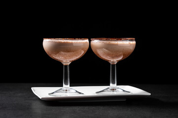 Classic Brandy Alexander cocktail on black background