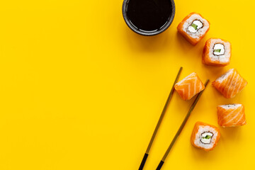 Sushi rolls set with salmon flatlay on table, top view © 9dreamstudio