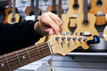 Electric guitar tuning in a music store