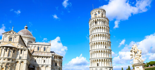 The bue sky view in Pisa Cathedral (Duomo di Pisa) with Leaning Tower  (Torre di Pisa) Tuscany, Italy.The Leaning Tower of Pisa is one of the main landmark in Italy.