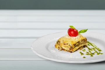Tasty fresh lasagna dish on white plate