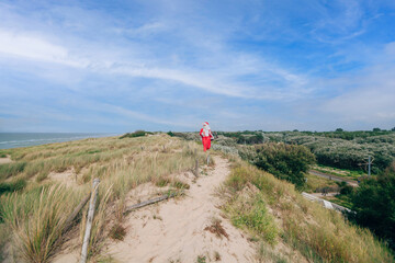 Santa Claus on holiday by the sea with walking on the dunes
