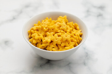 dry fresh corn stars in white bowl on ceramic