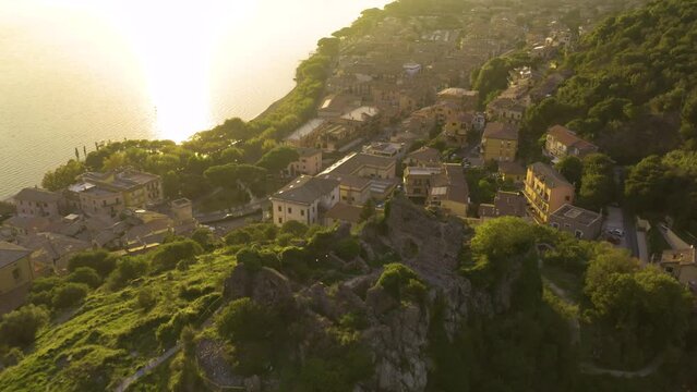 Aerial Pullback Reveals Historic Orsinis Fortress in Trevignano at Sunset