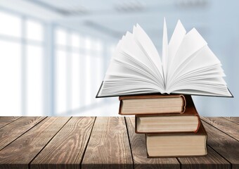 Reading book stack on blur interior