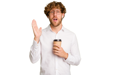Business caucasian man holding a coffee to take away isolated on white background surprised and shocked.