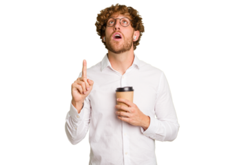 Business caucasian man holding a coffee to take away isolated on white background pointing upside with opened mouth.