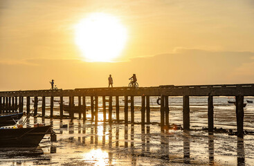 Evening at sunset around the fish bridge, the local fishing port, Bang Phra, Chonburi province, Thailand.