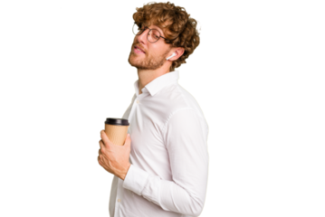 Business caucasian man holding a coffee to take away isolated on white background looks aside smiling, cheerful and pleasant.
