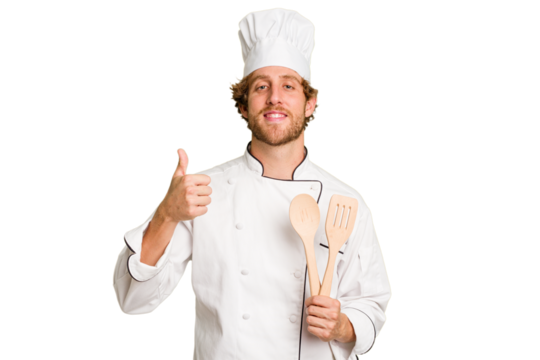 Young cook man isolated on white background smiling and raising thumb up