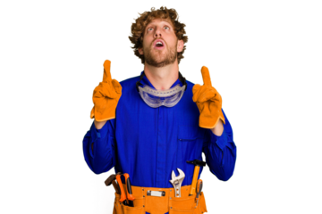 Young caucasian electrician man isolated on white background pointing upside with opened mouth.