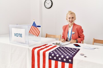 Beautiful caucasian woman working at political campaign winking looking at the camera with sexy...